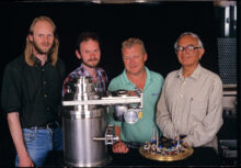 : David Cattermole, Howard Andrews, Steve Stubbings and Wasi Faruqi (L-R) with parts of a quad charge-coupled device array for an electron microscope, 1999