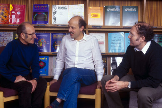 César Milstein, Michael Neuberger and Greg Winter, in the LMB Library