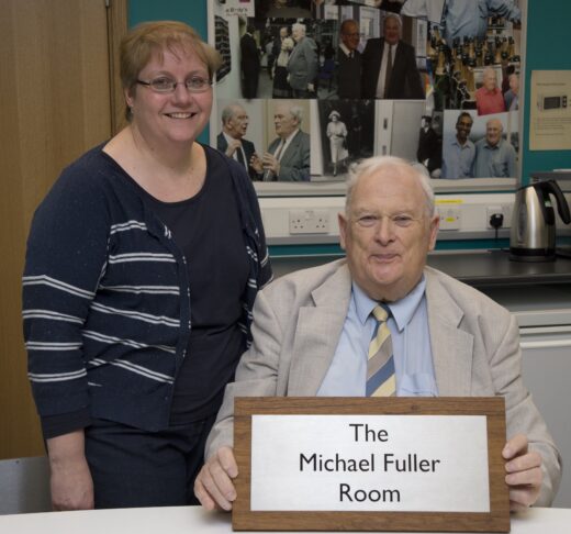 : Annette Faux stood to the left of Michael Fuller (seated) who holds a plaque reading ‘The Michael Fuller Room’