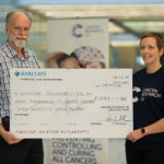 LMB give cheque to Cancer research UK