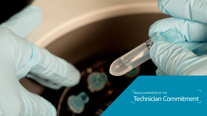Gloved technician places Eppendorf tunes in centrifuge, logo text reads proud supporter of the Technician Commitment.