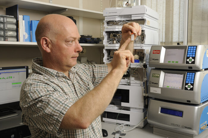 Chris Johnson in the LMB Biophysics Lab looking at a measurement