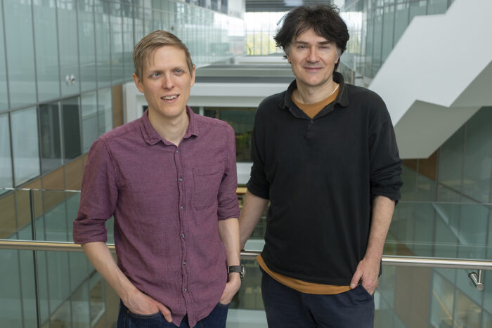 Photo of Ben Porebski and Philipp Holliger in the LMB atrium. 