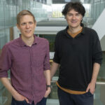 Photo of Ben Porebski and Philipp Holliger in the LMB atrium.