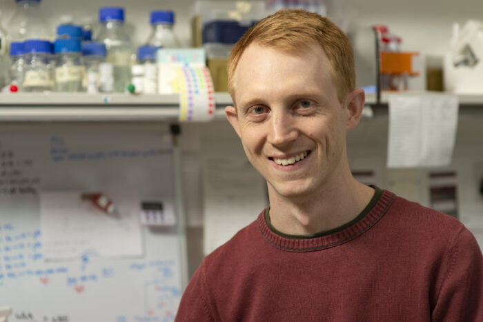 Photograph of Andrew Beale in a laboratory. 