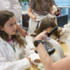 Two girls taking part in the See your Cells activity