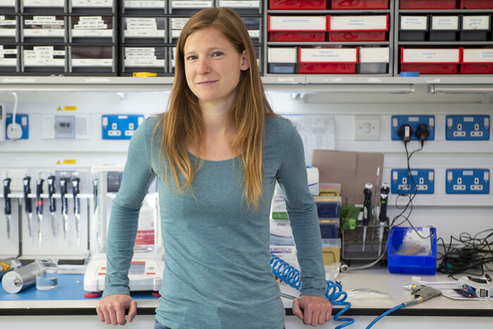 Poppy Marriott standing in front of a lab bench